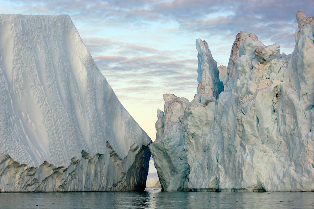 In Disko Bay, ice broken off from the Greenland Ice Sheet floats into the North Atlantic Ocean, raising sea level.