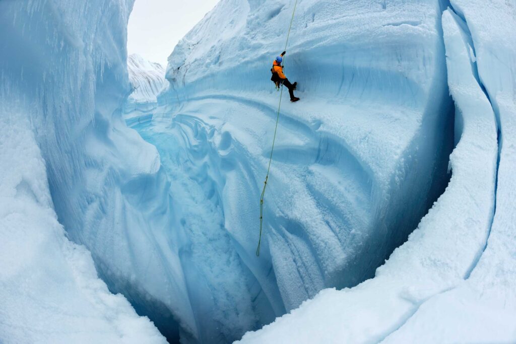 "EIS Director and Founder James Balog Rappelling into Survey Canyon #1", Survey Canyon, Greenland (2009)