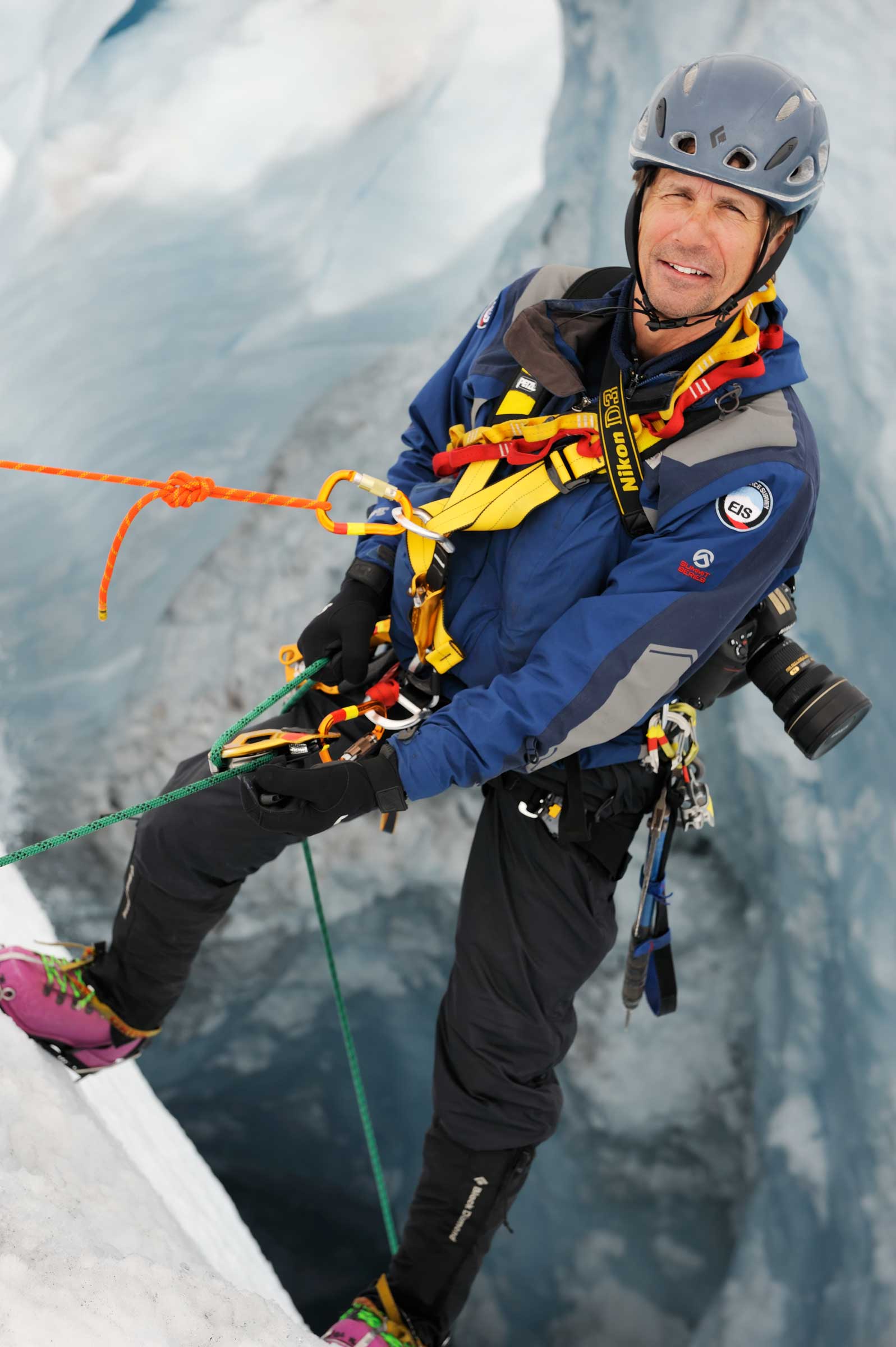 Extreme Ice Survey Founder and Director James Balog rappels into moulin, Moulin, Greenland (2008)